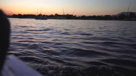 colourful sunset on the nilo river in egypt while cruising on sail boat