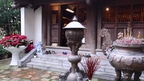 a serene temple courtyard with incense burners