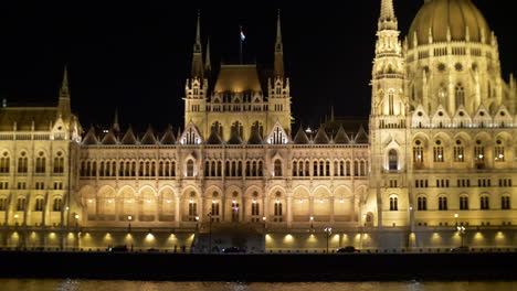 View-to-Hungarian-Parliament-at-night-from-Danube-river,-Budapest,-Hungary