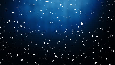 falling white particles animation over blue and black gradient background