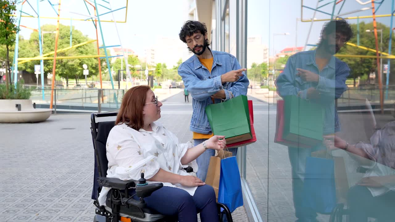Woman in Wheelchair and Man Shopping
