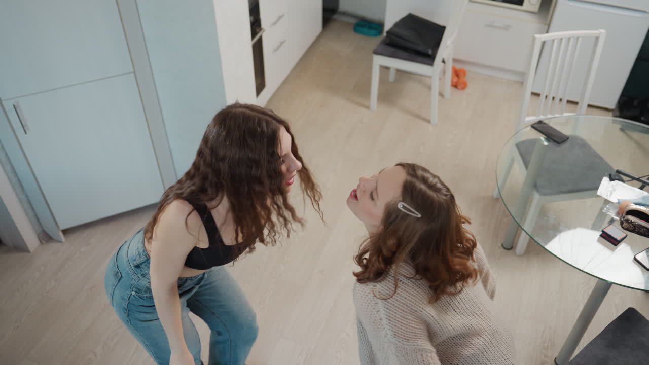 Sisters Share Smiles, Closeup Of Women Applying Lipstick, Caucasian Sisters Exchanging Laughter In Modern Kitchen, Intimate Scene Of Sisters Enjoying Makeup And Conversation Indoors
