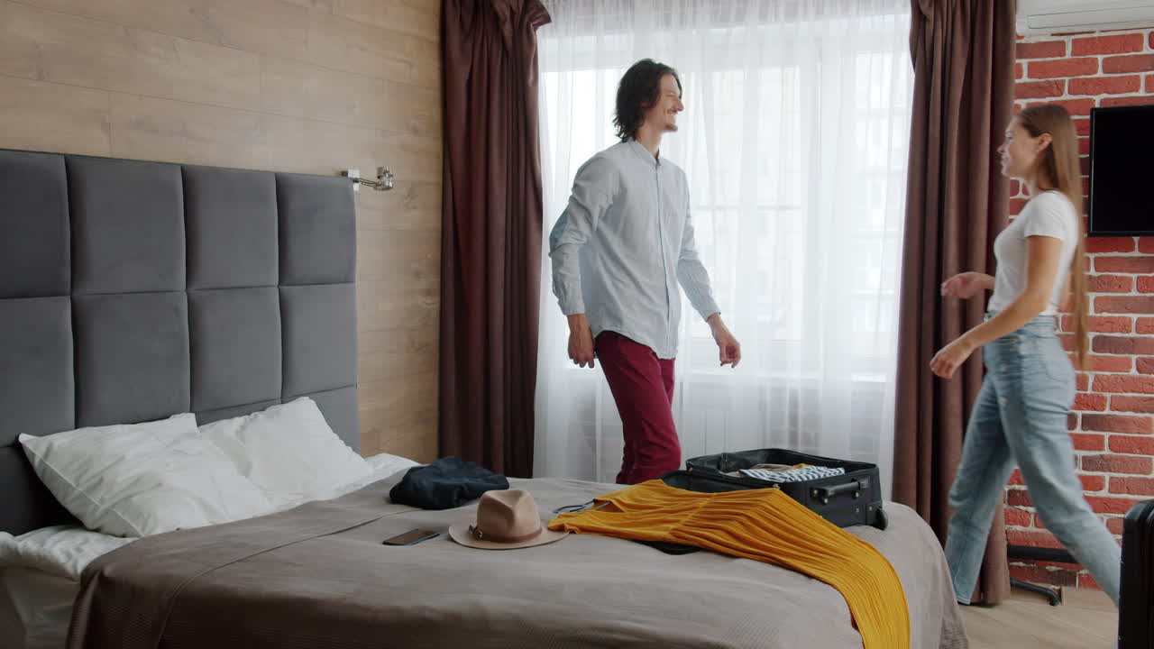 Couple Packing and Getting Ready for Vacation