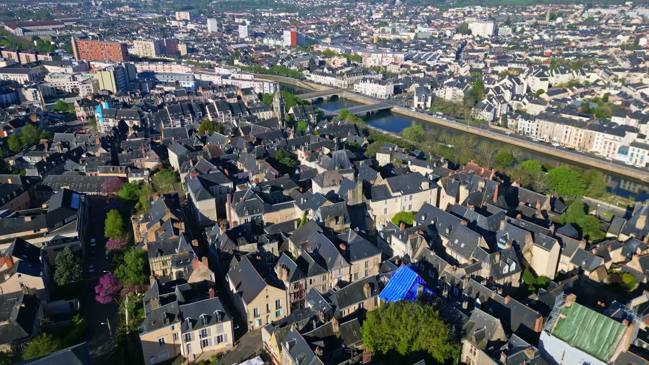 Old Le Mans, Sarthe river, and Eglise St Benoit in background, cityscape, France. Aerial forward