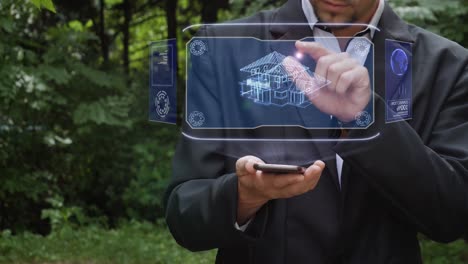 el hombre de negocios usa un holograma con la casa