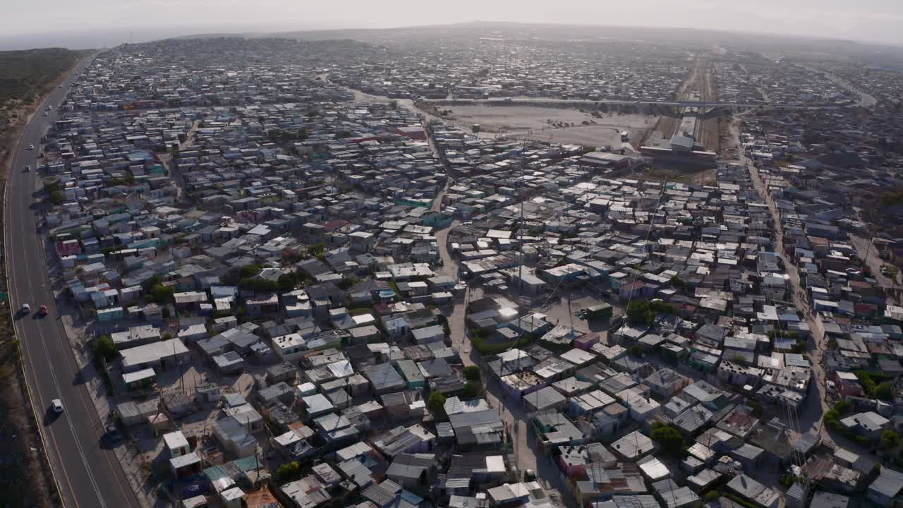 Aerial shot of township with corrugated iron huts and shacks in Khayelitsha in Cape Town Shouth Africa