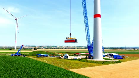 head of wind turbine construction at daytime - drone shot