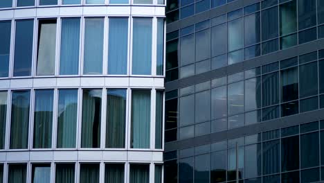 clouds flowing slowly  reflecting on glass business building