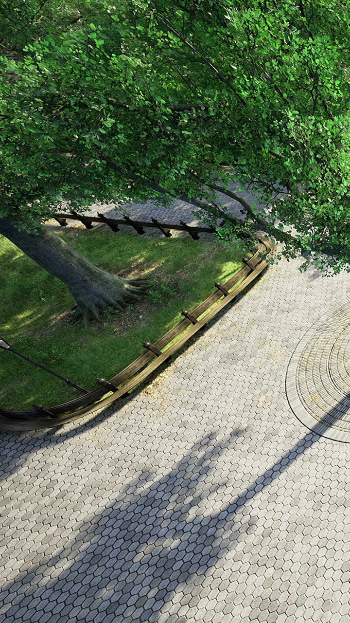 Curved pathway embraced by lush trees invites peaceful wandering amidst nature