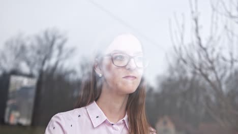 woman in quarantine looking out the window. staying home in self-quarantine