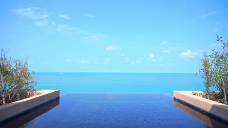 rooftop private infinity pool in the exotic hotel with a great view of the endless sea at daytime in thailand