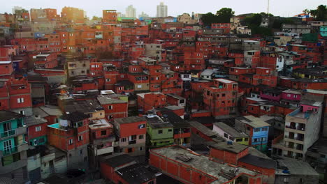 aerial view over colorful favela houses, sunset in a the villa lobos ghetto, in sao paulo, brazil