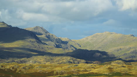 cloud shadows racing over mountainous and rugged landscape