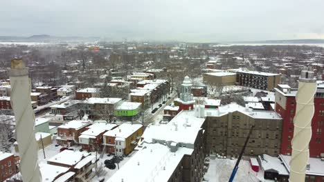 View-of-a-small-neighborhood-with-chimneys-that-emit-white-smoke