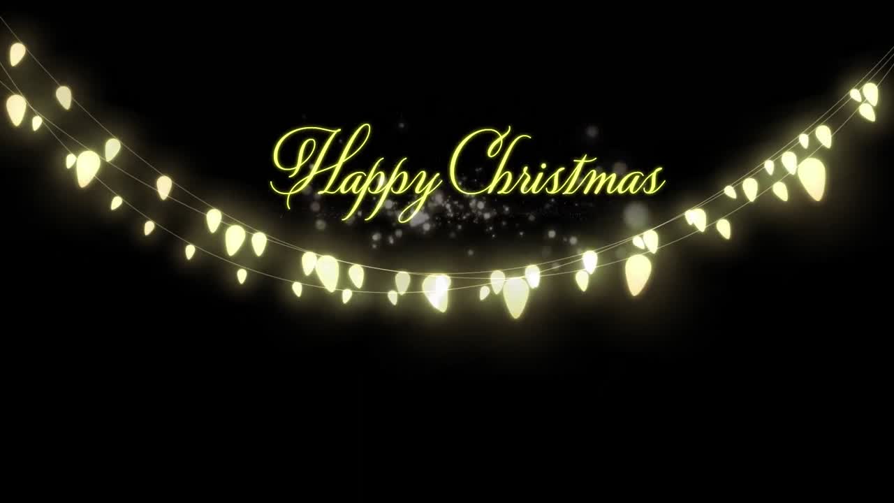 feliz texto de navidad y puntos de luz sobre luces de hadas decorativas colgando en fondo negro