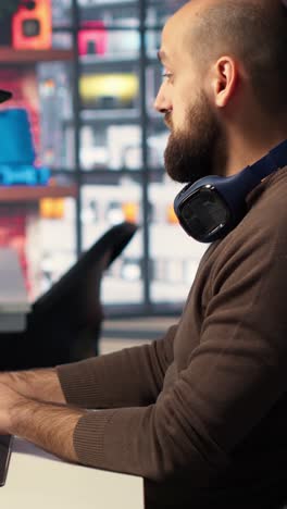Vertical Video Workers in office use CAD software to design a house interior