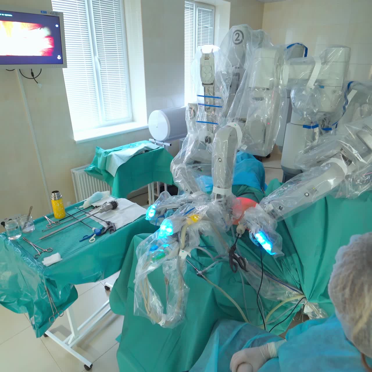 Surgery with robotic system. Surgeon team using medical robotic system
