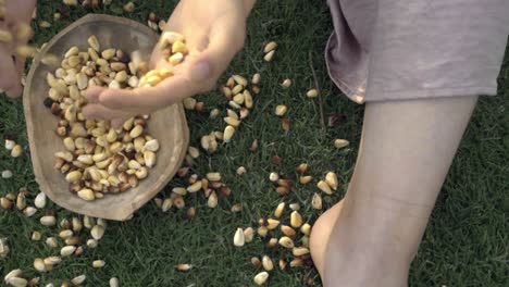 Girls holding corn before cook it barefoot