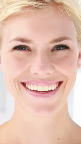 pretty blonde woman looking at camera in office