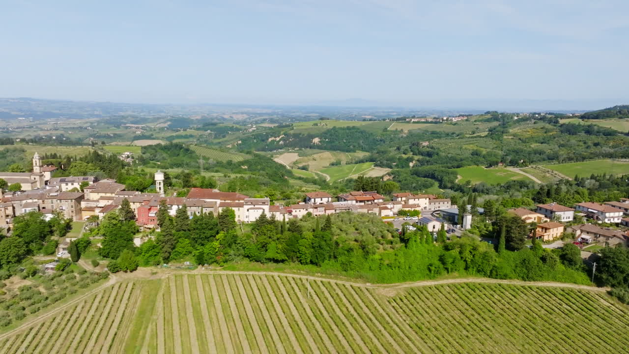 Aerial parallax shot in front of the Marcialla town, summer day in Tuscany, Italy