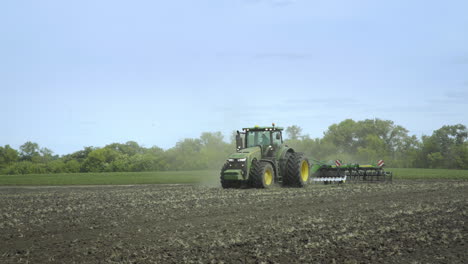 farming tractor preparing land for sowing. agricultural technology