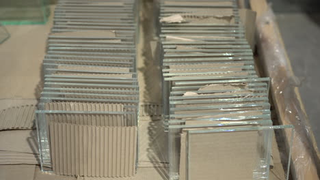 multiple glass panels stacked in a row with a spacer made by cardboard in between