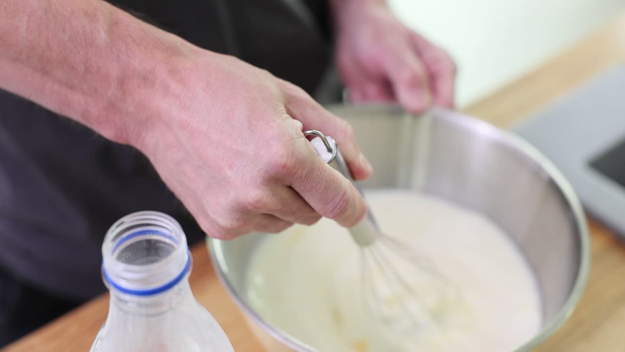 Preparing food with milk and a whisk