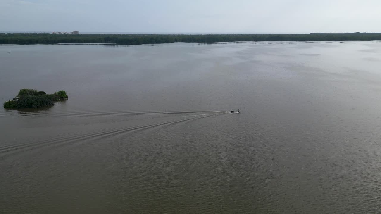 Drone's eye view boating in Manialtepec near Puerto Escondido, Oaxaca, Mexico