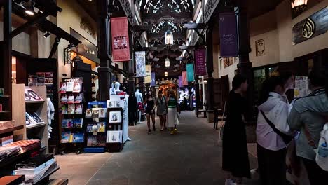 people exploring shops in a vibrant marketplace