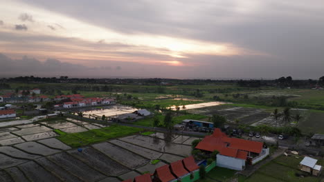 Golden-hour-sunset,-water-becomes-mirror-in-fields-reflecting-the-sky-above