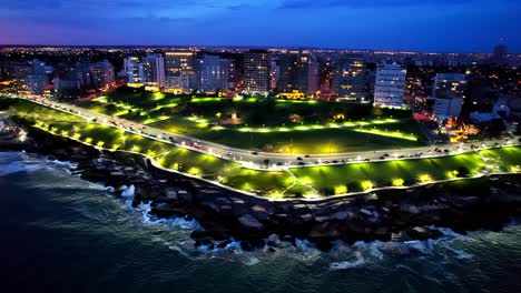 colorful panoramic aerial of urban waterfront park at night, plaza españa, mar del plata, argentina