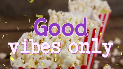 Animation-of-good-vibes-only-text-over-boxes-of-popcorn