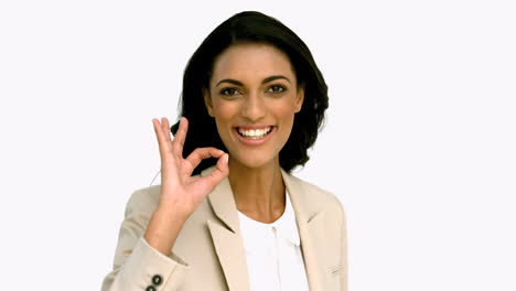 businesswoman giving ok sign