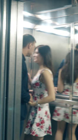 couple kissing in elevator