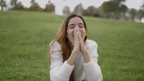 woman expressing happiness in a park