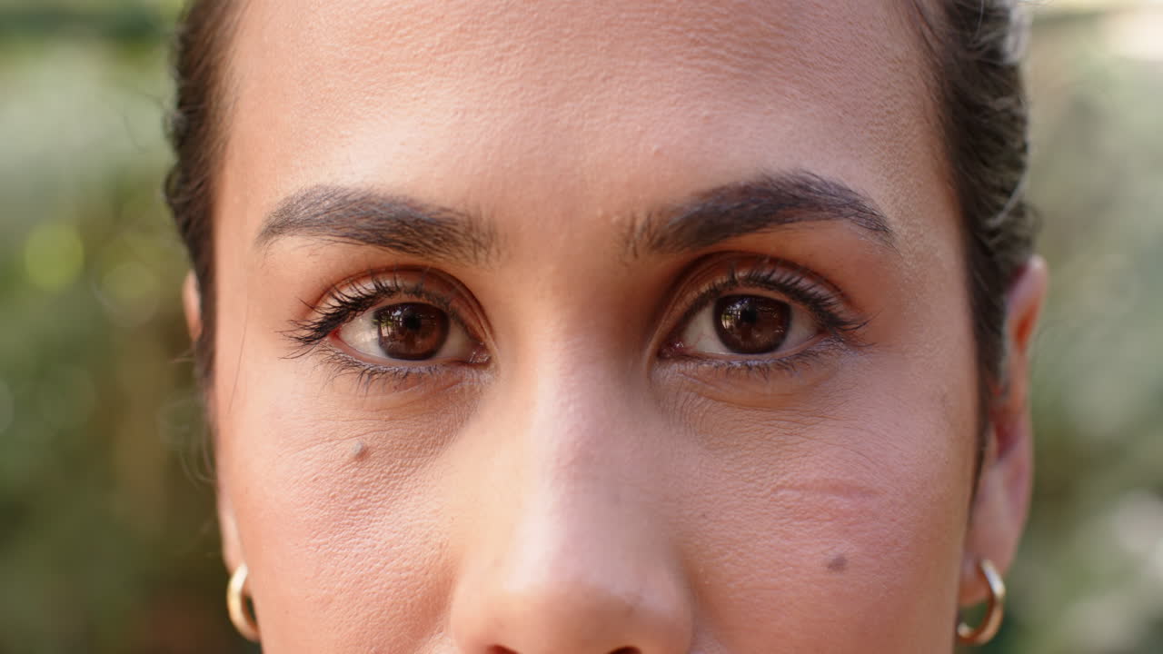 Close-up of woman's eyes and face, focusing on natural beauty and expression