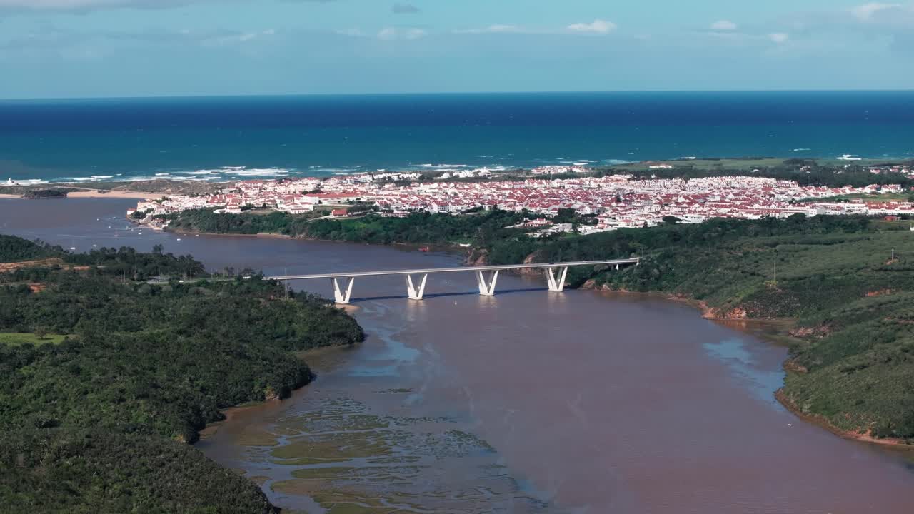 Aerial View of a Coastal Town with a Bridge over a River in Portugal