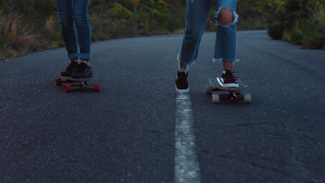 happy multi ethnic friends longboarding together riding skateboard cruising on countryside road having fun hanging out enjoying relaxed summer vacation