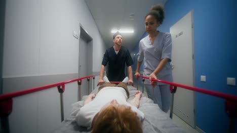 hospital staff transporting patient on stretcher