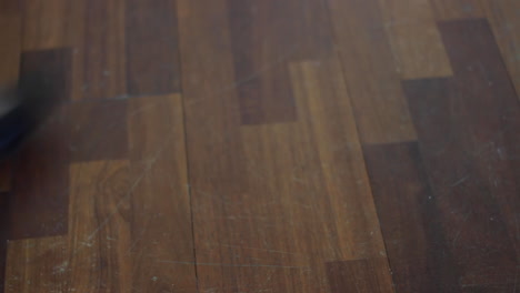 woman with heels drops a leather bag on the floor, close up