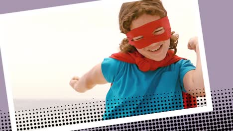 little girl wearing a superhero costume on the beach