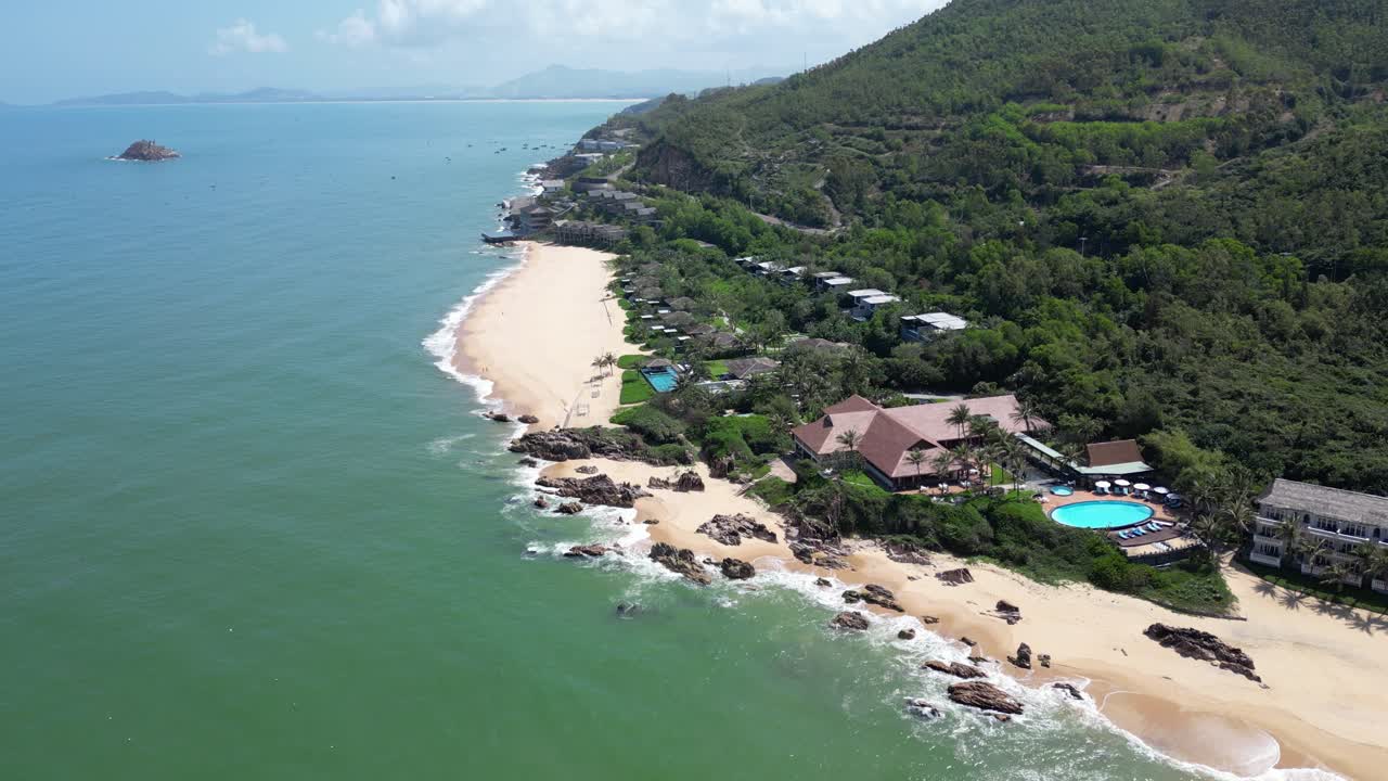 Luxurious tropical beach resorts, aerial drone slow motion view