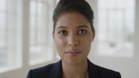 close-up-portrait-of-young-mixed-race-woman-looking-serious-at-camera-successful-lifestyle-positive-independent-female