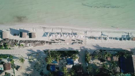 Tropical-white-sandy-shore-of-Holbox-beach-in-Mexico,-top-down-aerial