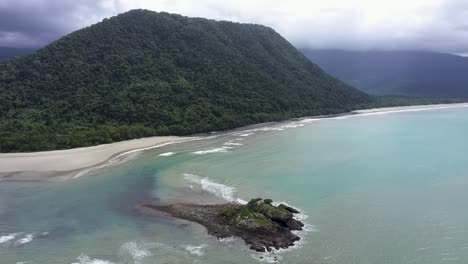 daintree rainforest and noah beach drone aerial with mountain and clouds, queensland, australia