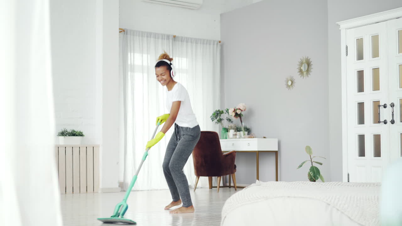 Woman Cleaning and Dancing in a Stylish Home