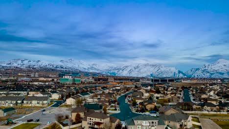 lehi, utah and silicon slopes in winter with snow in the mountains - aerial hyper lapse at twilight