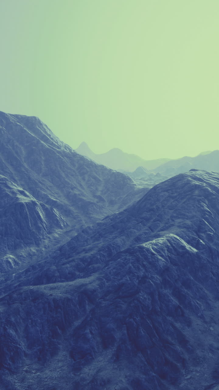 Majestic mountains shrouded in fog under a brilliant morning sun