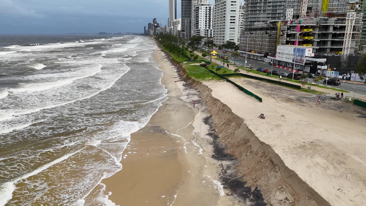 Aerial view of severe beach erosion along Gold Coast, Australia, highlighting environmental impact and urban proximity