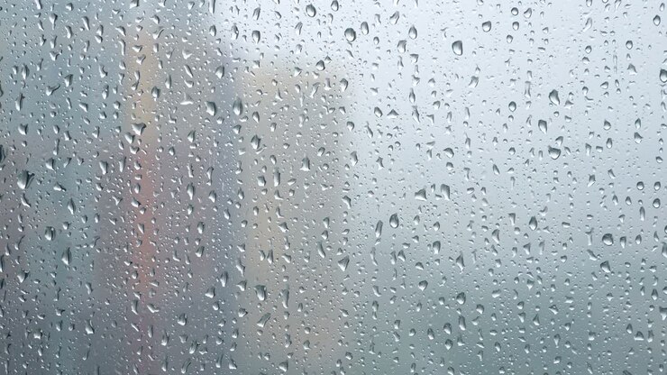 Rain drops on window. Rainy weather. Closeup